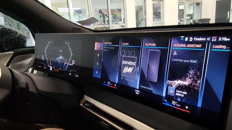 BMW curved display showing navigation and infotainment